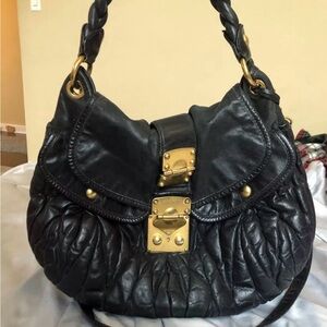 Authentic black MIU MIU Lambskin Napa Matelasse with lock and key.
